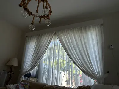 White fabric curtains with sheer inner panels - ready to hang