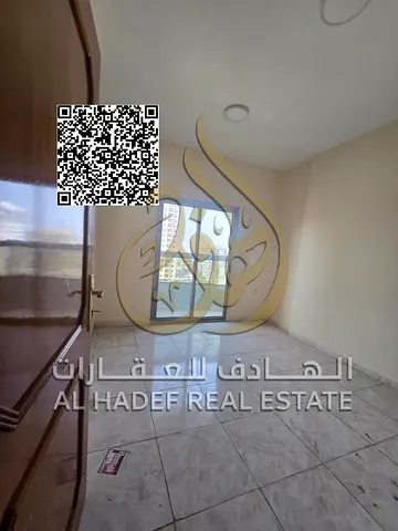 Two-bedroom apartment with a living room in Al Naeemiyah 1, Ajman, with two bathrooms, a balcony an
