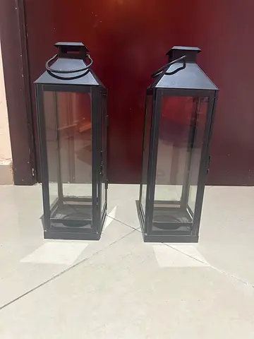 Pair of tall black metal glass lanterns for candles (75 AED  each)