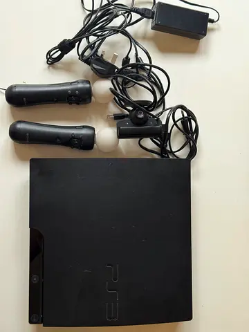 Sony PS3 Slim console with two Move controllers and camera - Good working condition