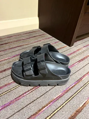 Black double-strap buckle slide sandals (size not specified) - gently used