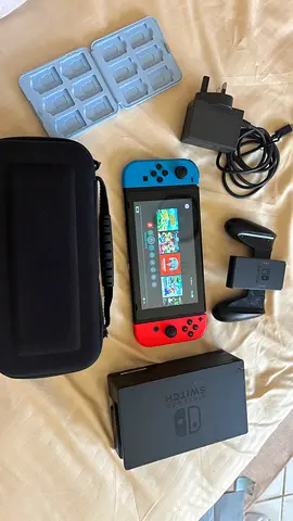 Nintendo Switch console with dock, Joy‑Cons, charger, case and game card holder - good working