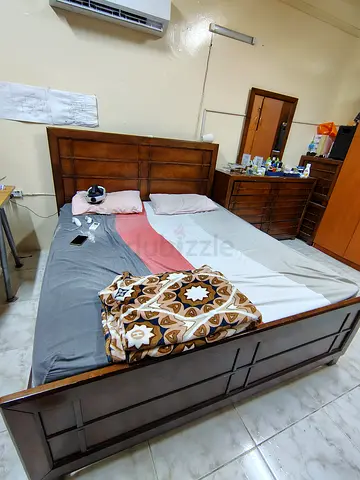 Solid wood double bed frame with headboard and storage base - dark finish
