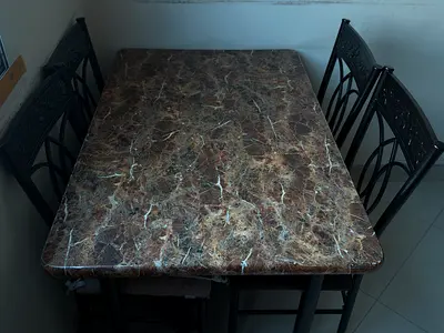 4-seater marble-top dining table with metal chairs asking price:300( negotiable)
