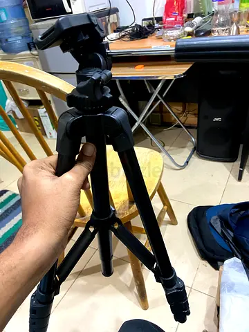 Lightweight adjustable camera tripod with quick-release head