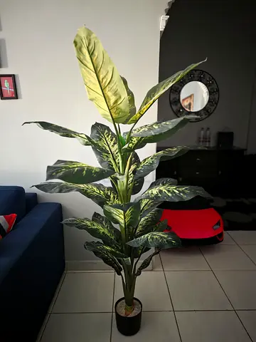 Tall artificial indoor plant in black pot - good condition