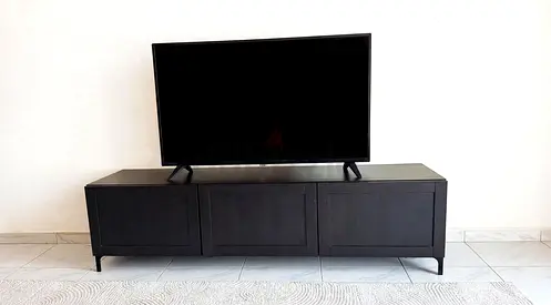 Low Black TV Cabinet / Entertainment Unit with Storage - Good Condition and tv Philips for sale