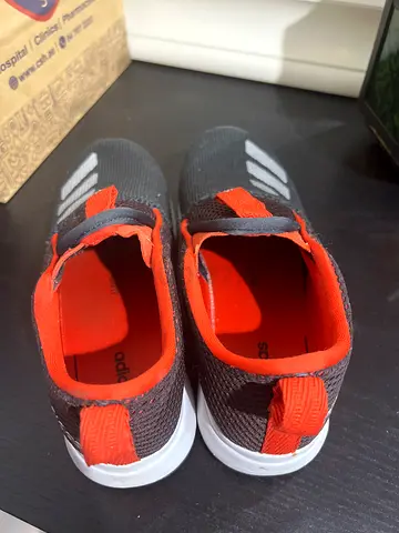 Grey and orange slip-on kids sneakers, lightly used