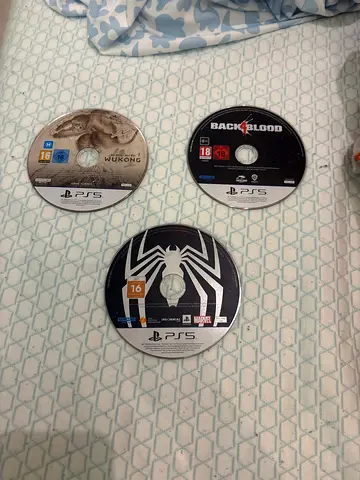 Three PS5 Game Discs — Back 4 Blood, Spider-Man 2, wukong black myth