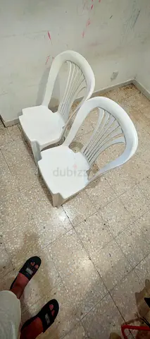 Set of 2 White Plastic Chairs — Good Condition, Stackable
