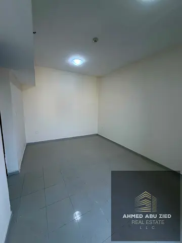 1BR + living room in Al Pearl, high floor with parking. Annual rent AED 32,000 in 4 installments. Ideal location for comfortable living.