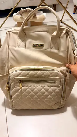 Cream quilted backpack bag - good condition