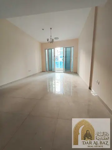 Direct view of Al Qasba Canal and free parking! High-end, two-bedroom apartment with a living room and central air conditioning in Al Majaz 3.