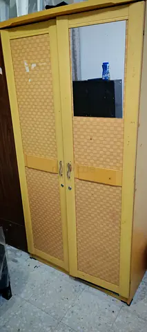Used two-door wooden wardrobe with mirror - good for bedroom storage