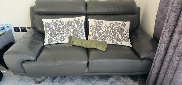 Grey leather two seater sofa