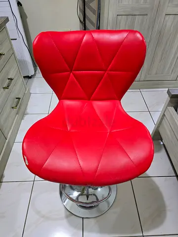 Red adjustable bar/makeup stool with chrome base, gently used