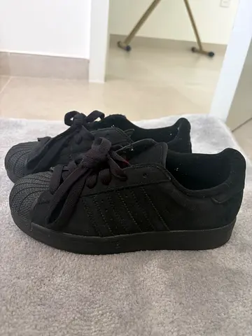 Black Adidas-style low top sneakers, size unknown, gently used