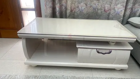 White gloss coffee table with drawer and 10 seater long couch-good condition (price negotiable)