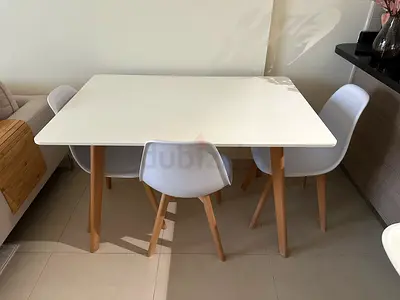 Home Centre dining table with 5 chairs - white top, wooden legs
