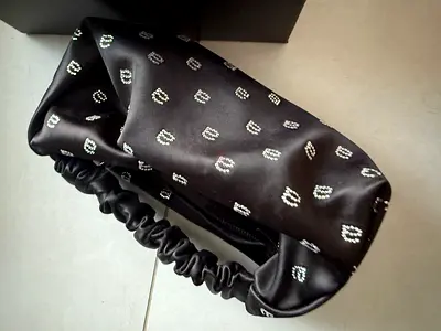 Alexander $%&! Black satin hand bag with diamanté pattern - like new