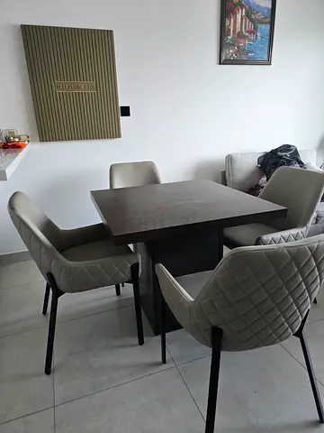 Elegant 4 seater Rich Wood Dining table along with 4 diamond quilted upholstered chairs.