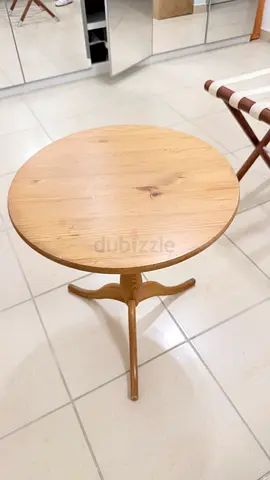 Small round wooden side table with tripod base