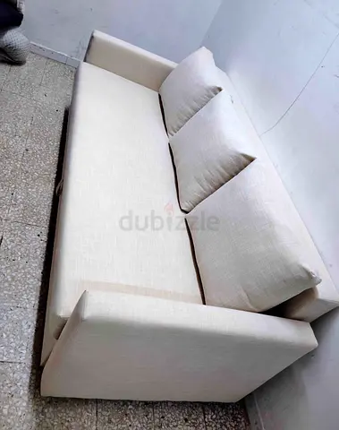 Light beige 3-seater sofa bed in good condition