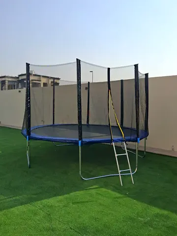 6ft Outdoor Trampoline with Safety Net and Ladder - Good Condition