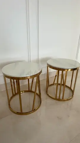 Pair of gold metal side tables with faux marble tops