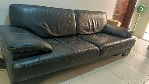 Used black leather 3-seater sofa — sturdy, some wear