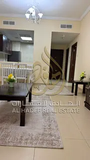 For rent in Ajman, an apartment with a furnished room and a living room in Al-Yasmin Towers, a large