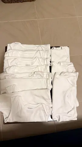 Carter’s 10 pieces tank top white. Size 9-12, bundle price 15 dhs