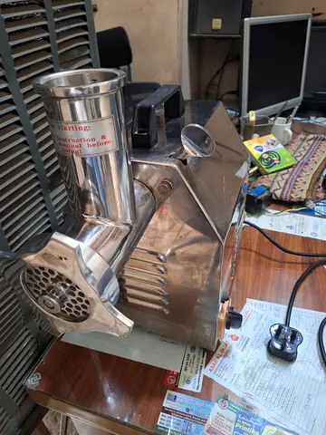 Commercial stainless steel meat grinder / mincer - used