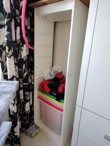 Slim white wardrobe cabinet — good condition