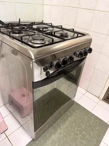 Used 4-Burner Stainless Steel Gas Cooker with Oven - Good Working Condition