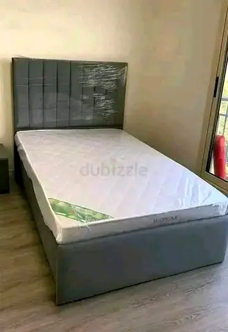 Single grey upholstered bed frame with mattress - good condition
