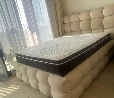 Queen upholstered platform bed with mattress - cream tufted design