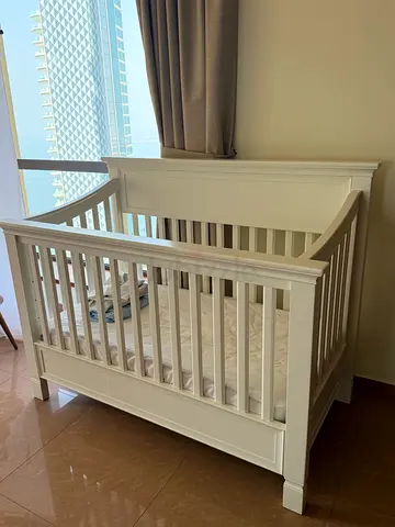 White wooden baby crib + Mattress + Bedsheets