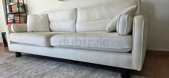 3-seater cream fabric sofa in good condition with pillows