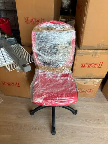 Red ergonomic office chair with adjustable height (used)