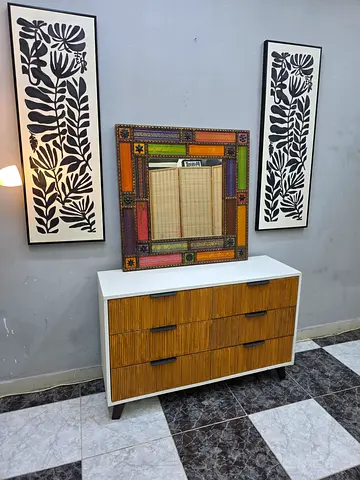 Mid-century modern low wooden cabinet with rattan-style doors