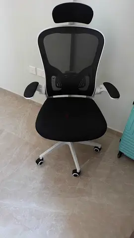 Black ergonomic mesh office chair with headrest — good condition