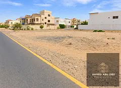 For sale: residential land for villas in Al Muweihat 1, Ajman. Divided into two plots, one corner pl