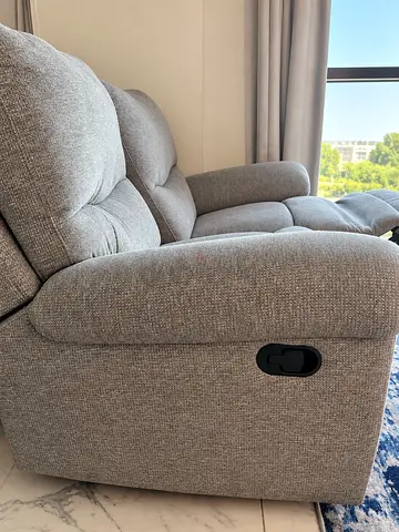 Light grey 2-seater reclining sofa in good condition