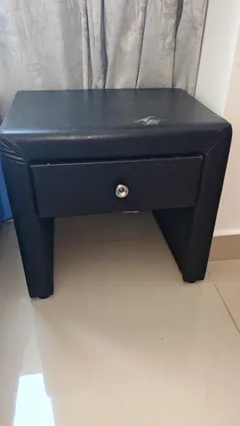 Black faux leather bedside table with drawer