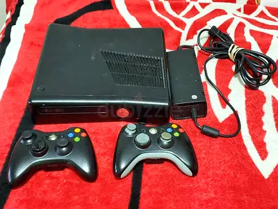Xbox 360 Slim console with 2 wireless controllers