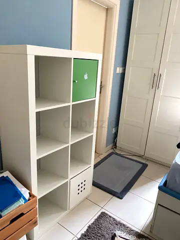 White 8-Cube Storage Shelf with Green Door — Good Condition