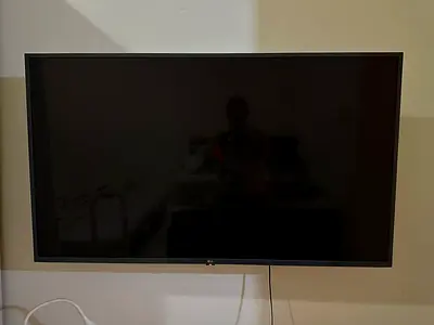 LG 55-inch LED Smart TV — Wall Mounted, Excellent Condition with wall brackets