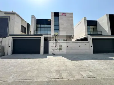 Modern villa for sale with a stone façade and a prime location