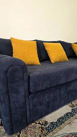 Blue three-seater sofa with mustard cushions - 1 month used only.